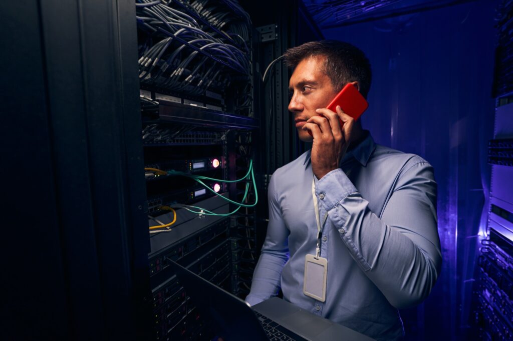 Data center IT professional monitoring network server performance